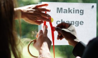 Hands writing making change